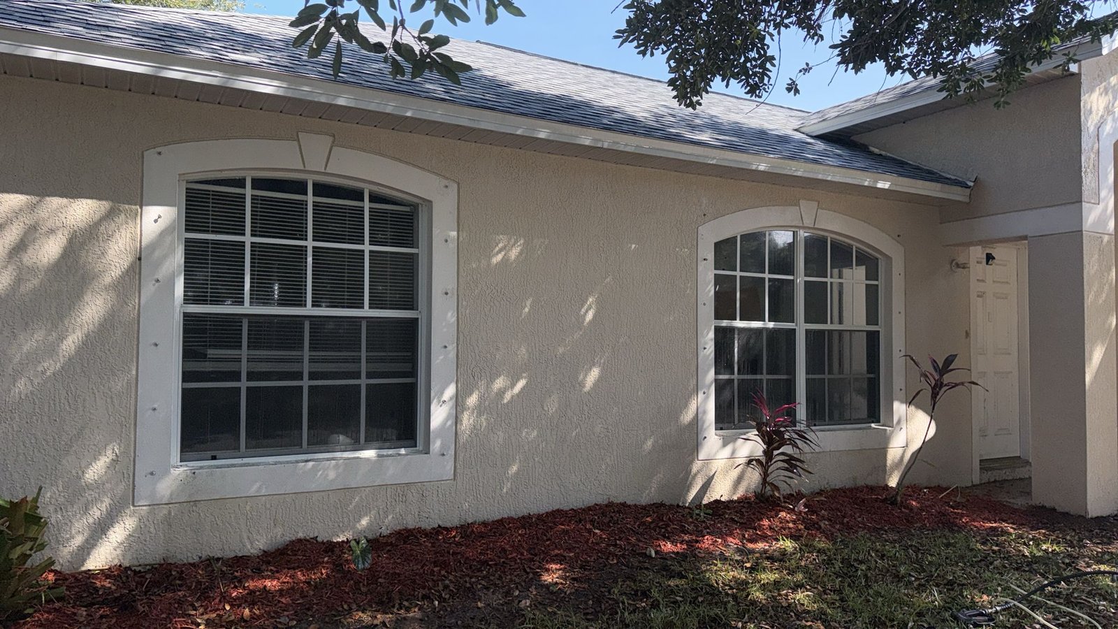 House facade before pressure washing